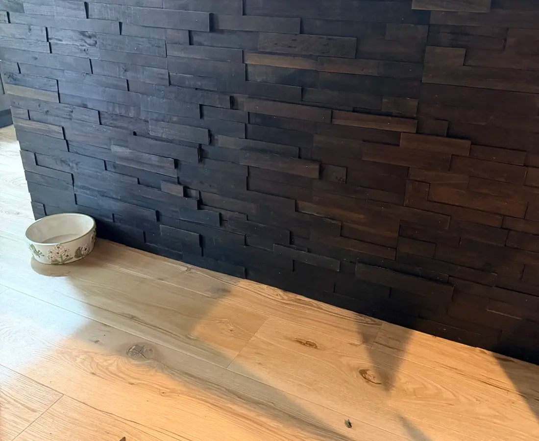 Dark wood accent wall installed by WestStone Services
