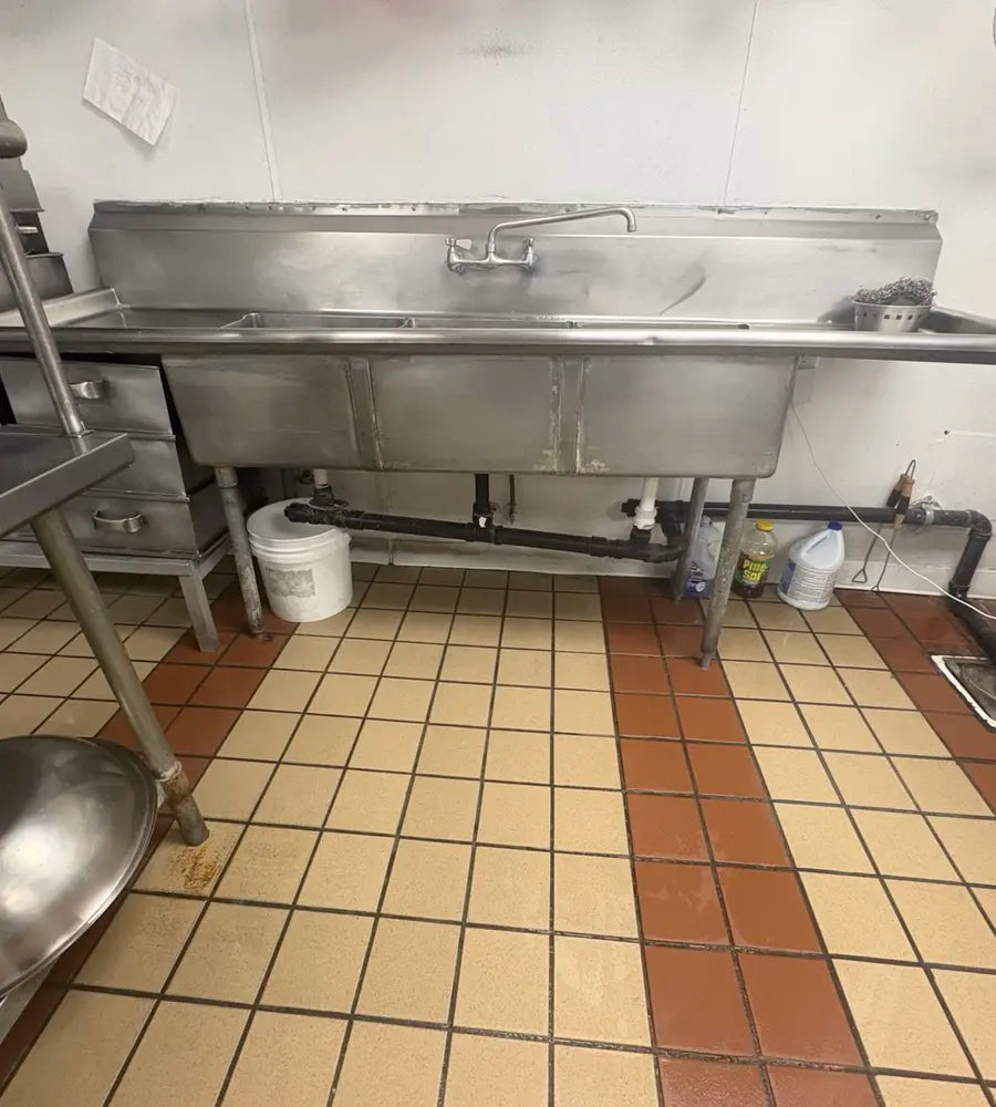 Commercial sink plumbing before repair